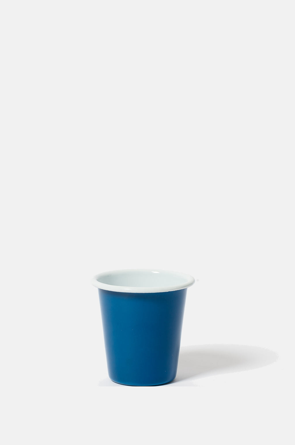 Falcon Enamelware dark mineral blue tumbler with white rim and interior.