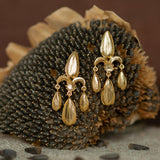 Sunflower Seed Fleur de Lis Chandelier Earrings Gold Plate