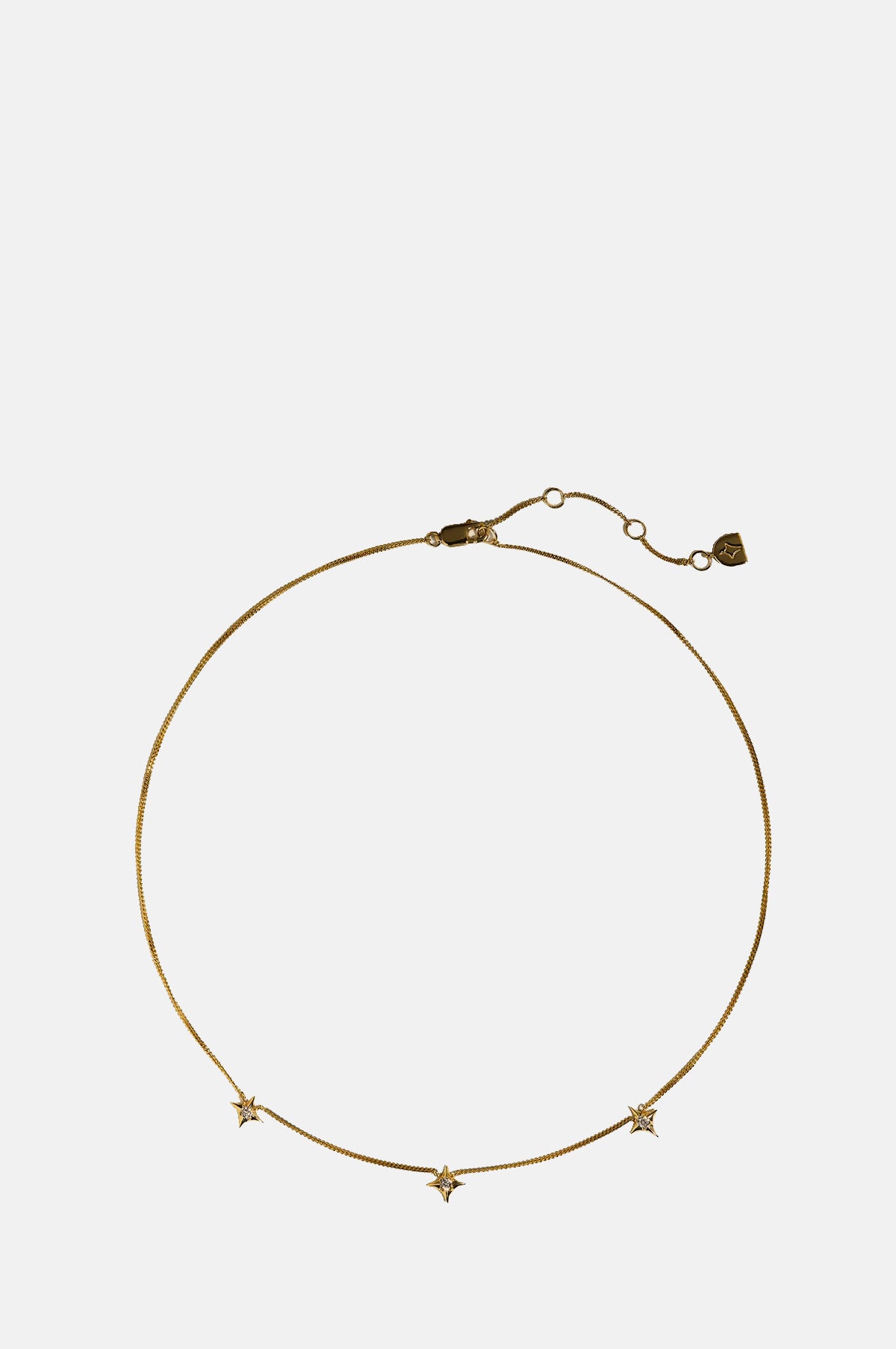 Astrid & Miyu Cosmic Star Charm Necklace in Gold.
