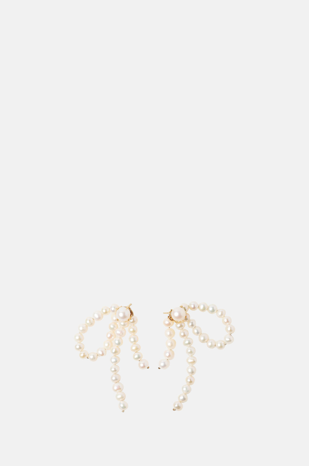Beatriz Palacios Half Bow Pearl Earrings.