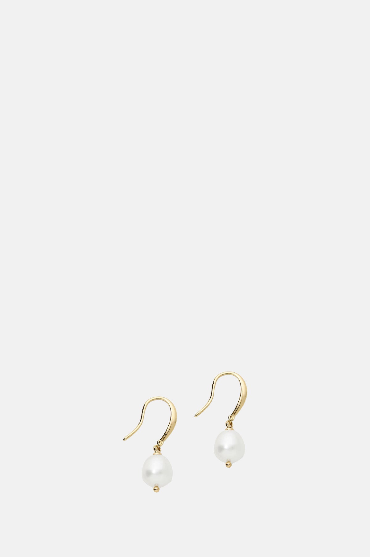 Olive and Piper Prado Pearl Gold Drop Earrings.
