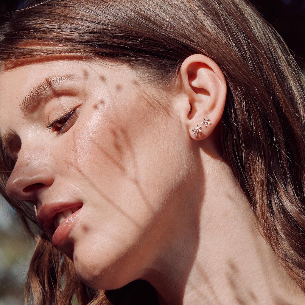 A.M. Asymmetric Growing Flower Stud Earrings Silver