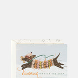 The First Snow Dachshund Dashing Through The Snow Christmas Greetings Card.