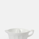 Mosser Glass milk white moulded glass juice reamer with pouring handle.