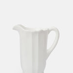 Mosser Glass moulded milk white panelled pitcher with irregular scalloped rim.